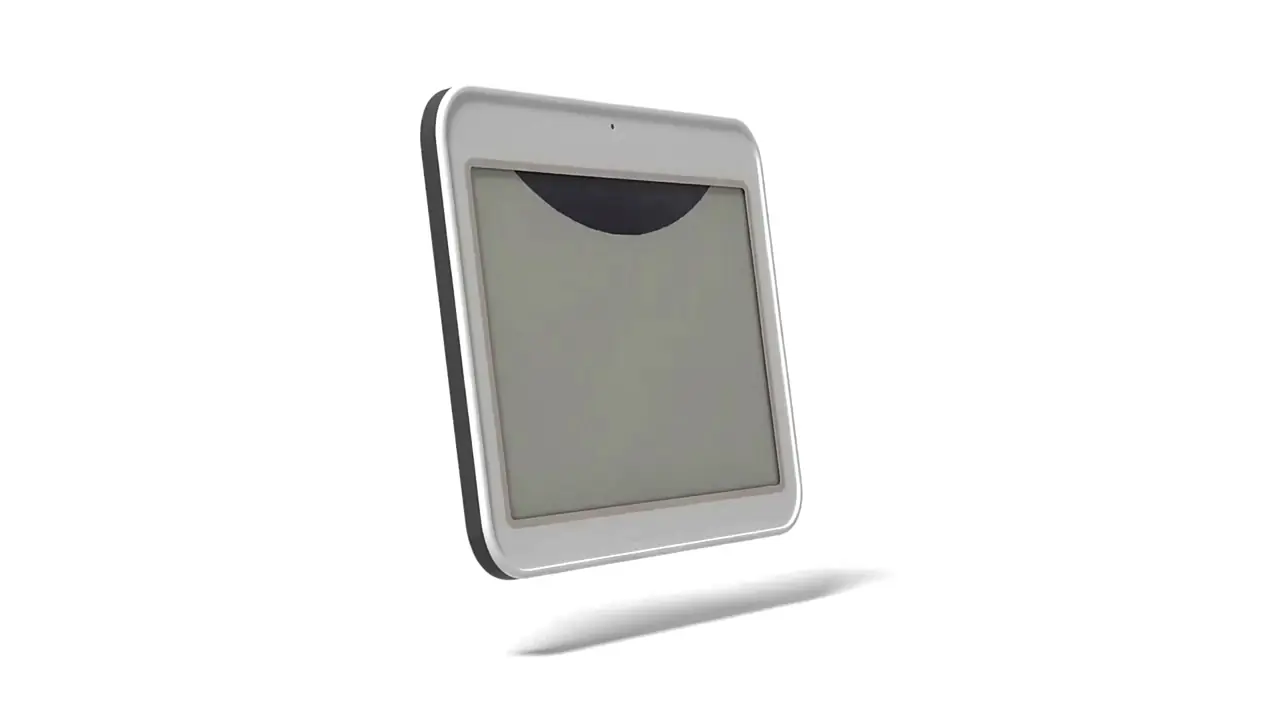 An e-ink label tilting from an angle to face the camera, its e-paper screen blank